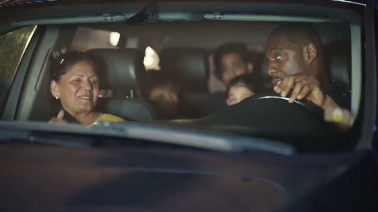 Idris Elba Windsurfs onto a Beach